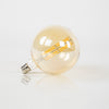 LED lichtbron filament E27 bol met amberglas ø15 cm